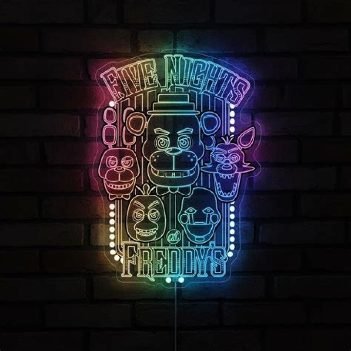 A neon sign featuring Freddy on top of the pizzeria in the 'Five Nights at Freddy's' teaser trailer