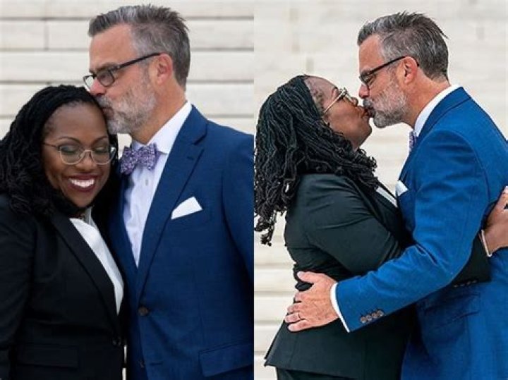 Patrick G. Jackson holding the Bible whiles his wife is sworn in 2