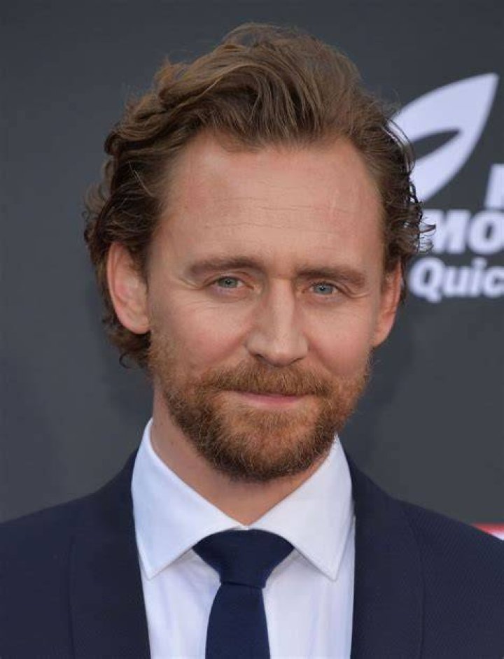 Tom Hiddleston's Loki dons his horned helmet as he controls time in the Loki season 2 finale.